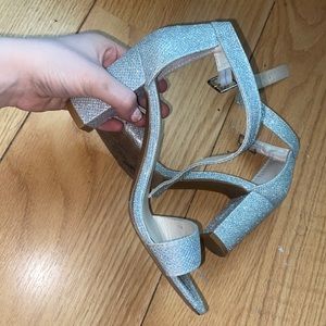 silver sparkle heels, about 2 in a half inches.